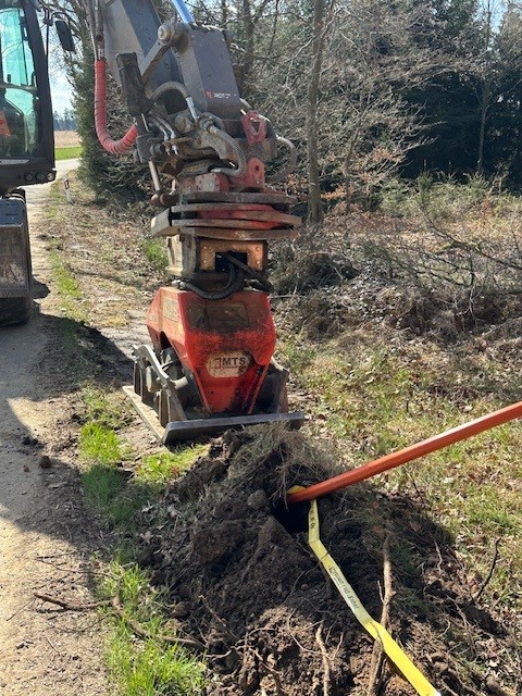 diggers installing pipework at the side of the runway at cork airport in ireland